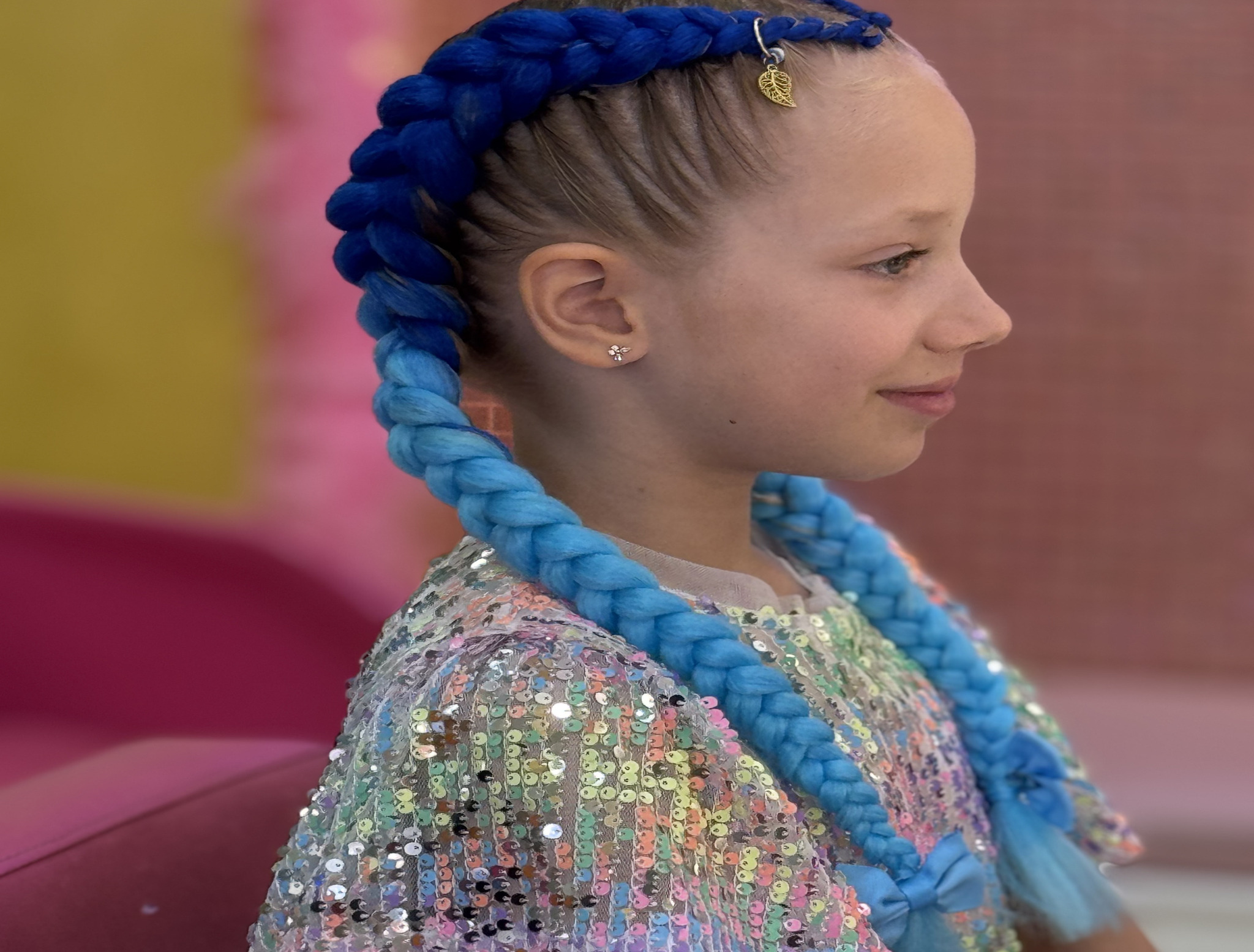 Girl with magical mermaid braids styled at StarKids Salon & Spa Dubai