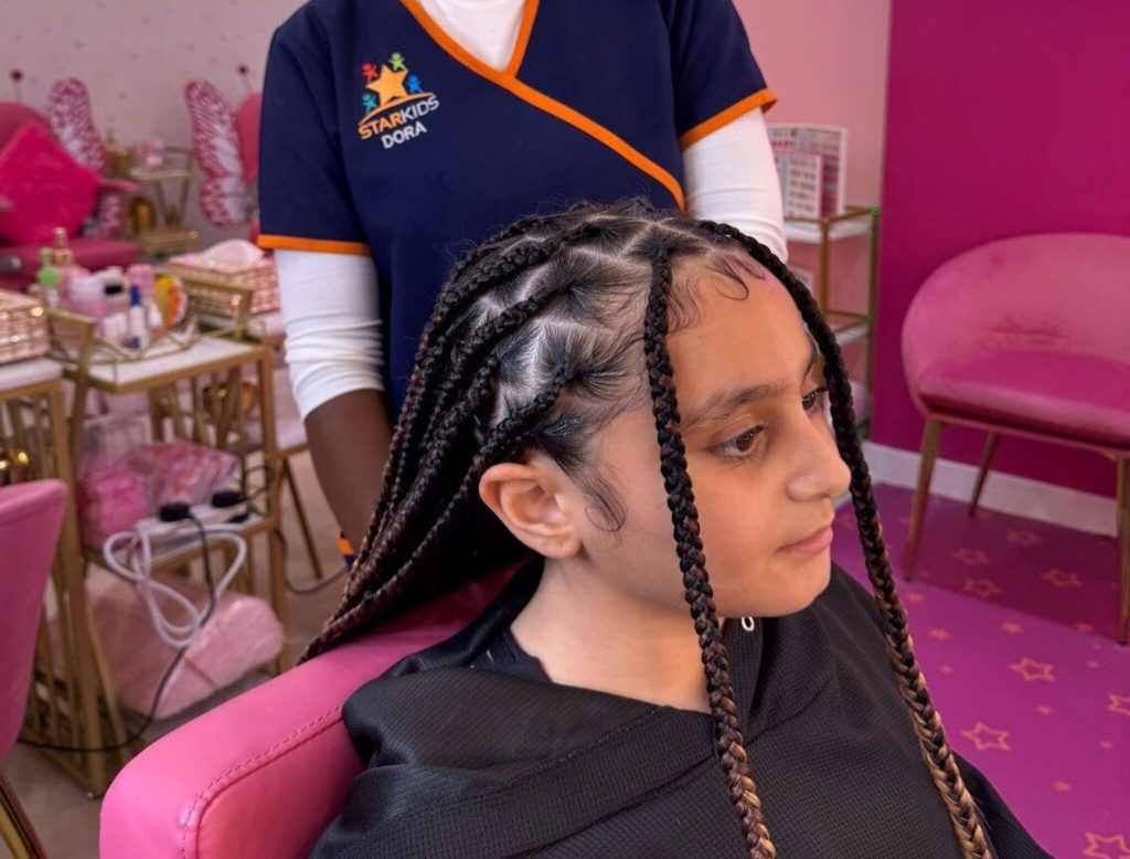 Protective winter braiding style for kids at StarKids Salon Dubai